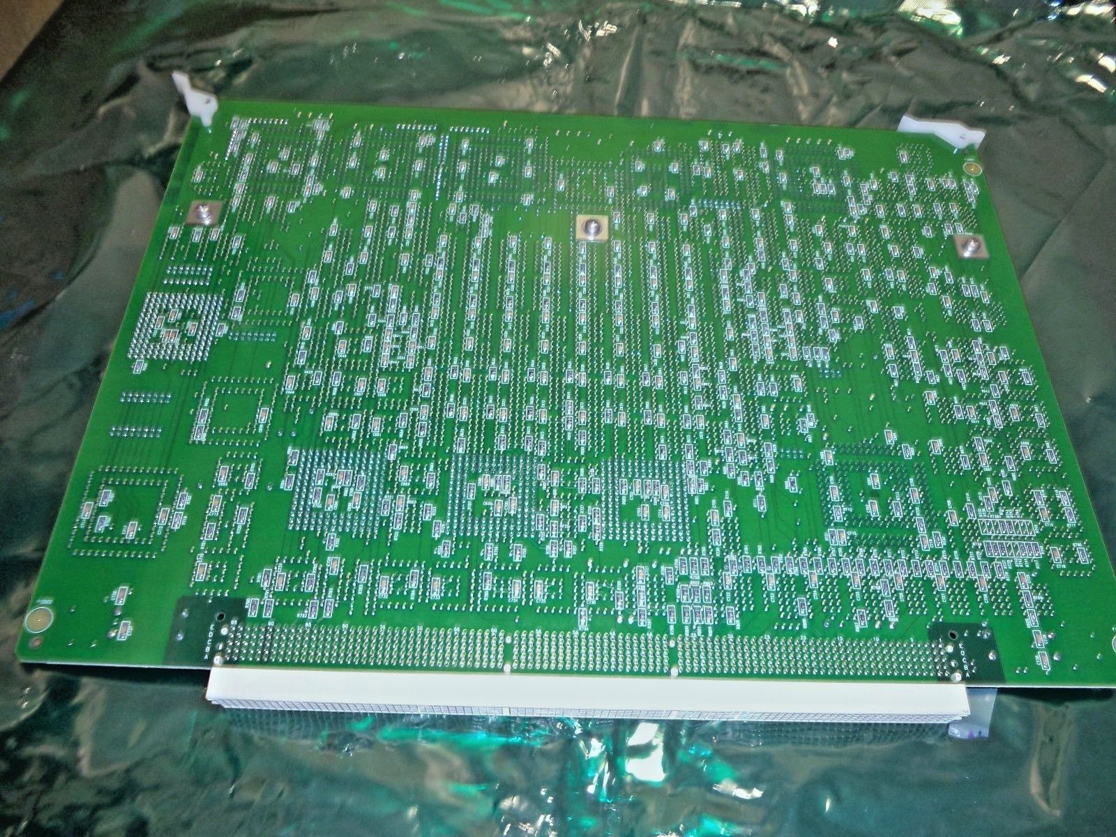 a close up of a green electronic board