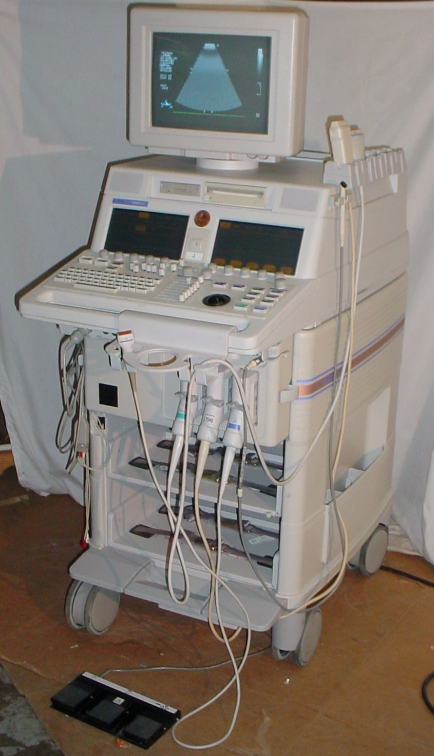 a medical machine with a monitor on top of it