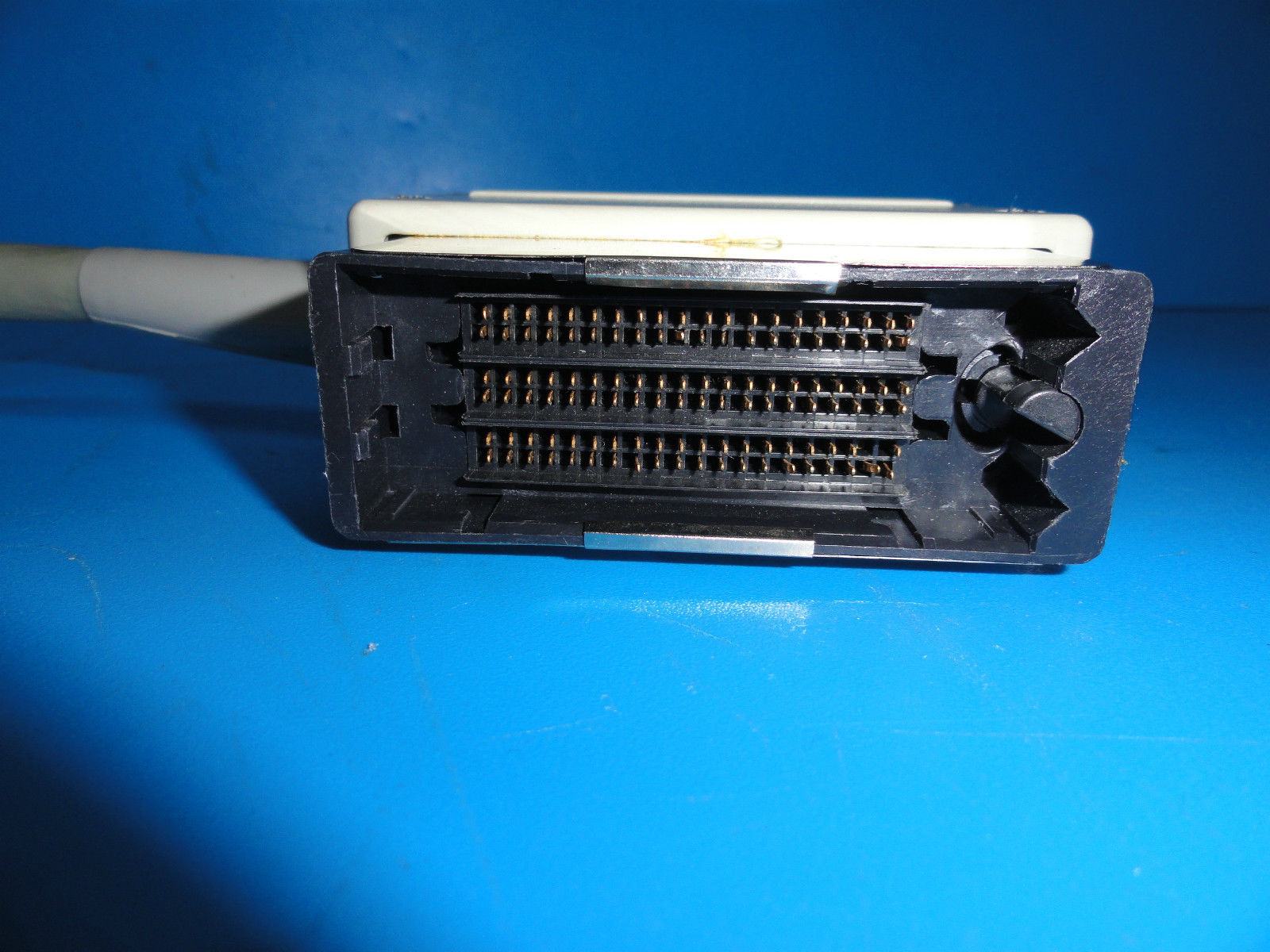 a close up of a device on a blue surface