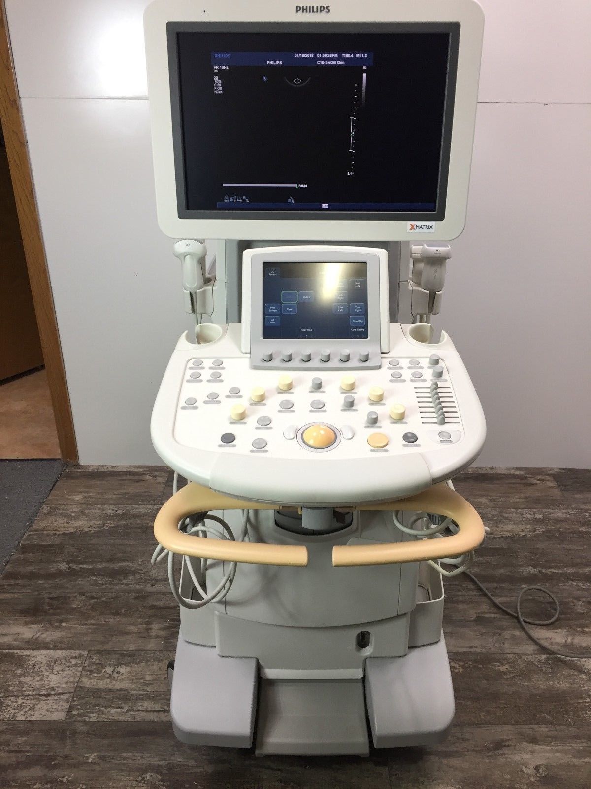 a medical machine with a monitor on top of it