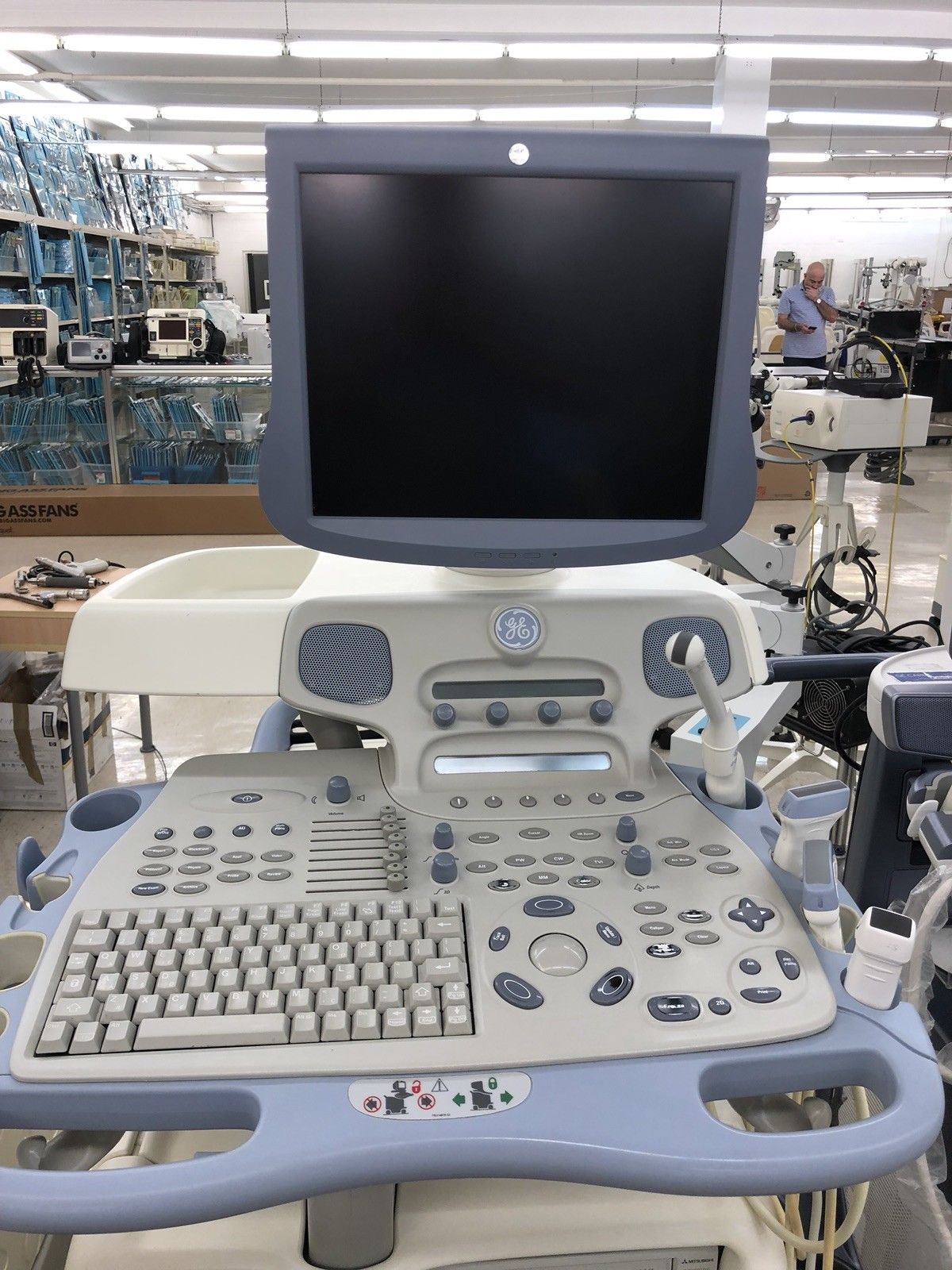a ultrasound monitor sitting on top of a hospital bed