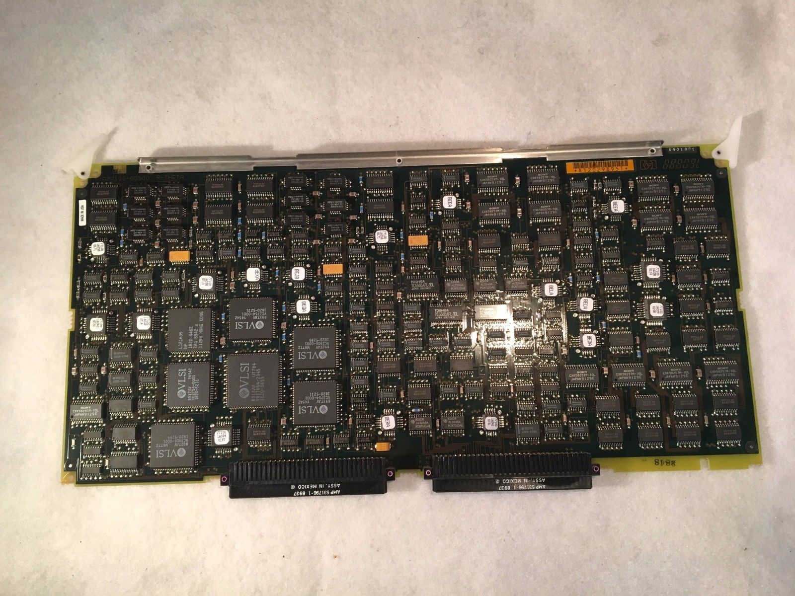 a close up of a computer motherboard on a white surface
