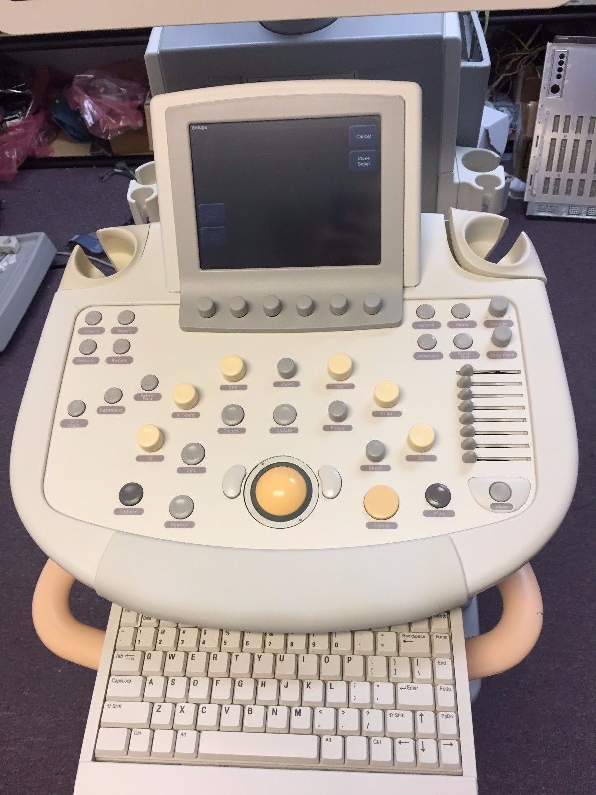 a computer sitting on top of a desk next to a keyboard