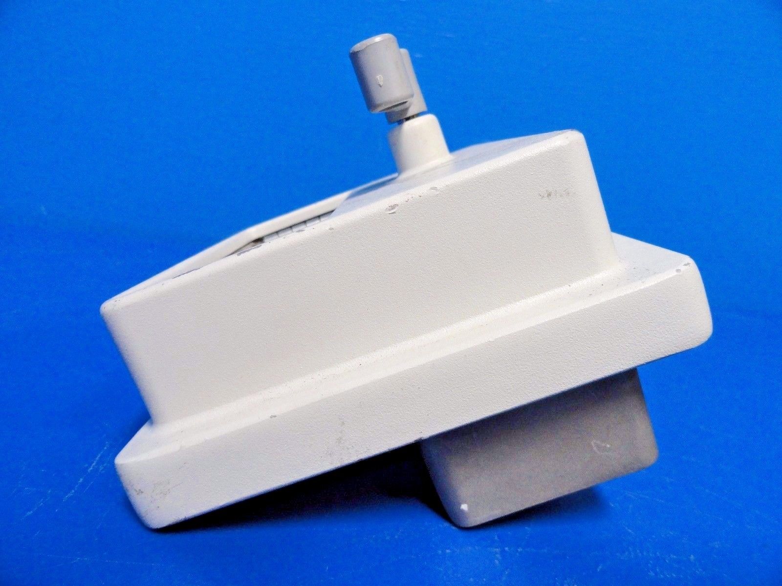 a close up of a white object on a blue surface